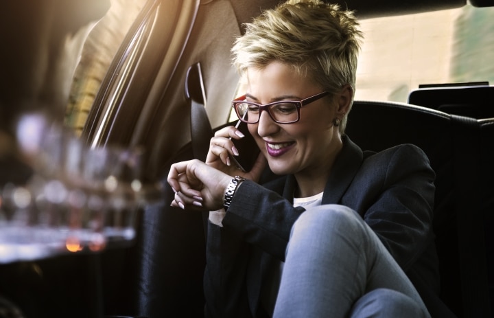 Woman traveling for work in a private car