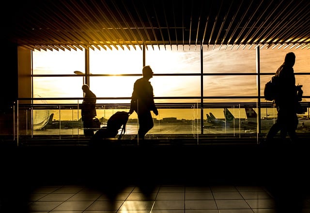 Business Executives travelling in the airport during the summer